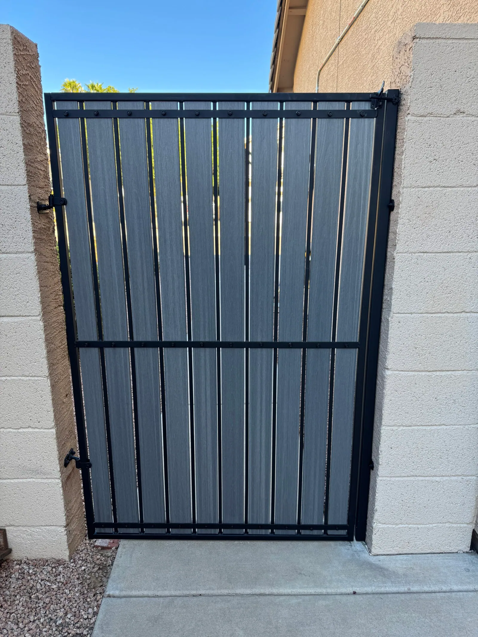 Finished side gate with a complete set of gray composite slats